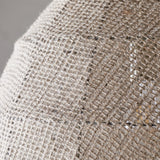 Close-up of the Jahari Woven Jute Pendant Light's natural open-weave dome, showing coarse knotted jute fibre with visible stitched seam panels.