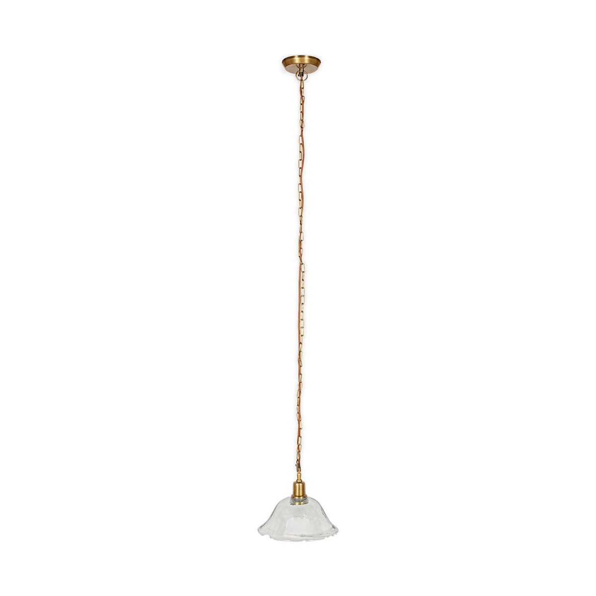 Keju Recycled Glass Pendant Light in Clear, a wide shallow glass bell with rippled rim on a brass collar, suspended from a long brass chain with rust fabric flex, shown on a plain white background.