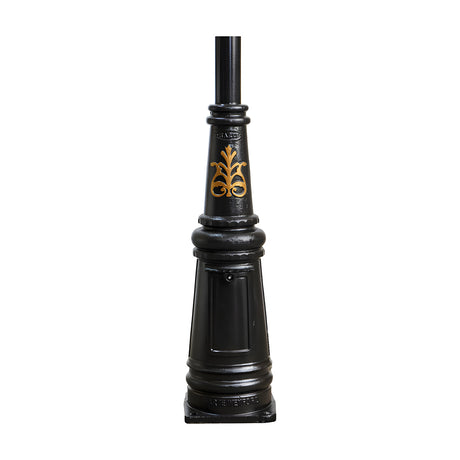 Victorian cast iron lamp post column in black with tapered fluted body, gold scroll motif, ring mouldings, and square base plate, shown on a plain white background.