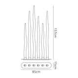 Line drawing of the Estalacta 6 Light Floor Lamp - Silver & Opal White, a tall sculptural piece with seven wavy elements on a rectangular base. It stands 157 cm high, 85 cm wide, and has a base depth of 15 cm.