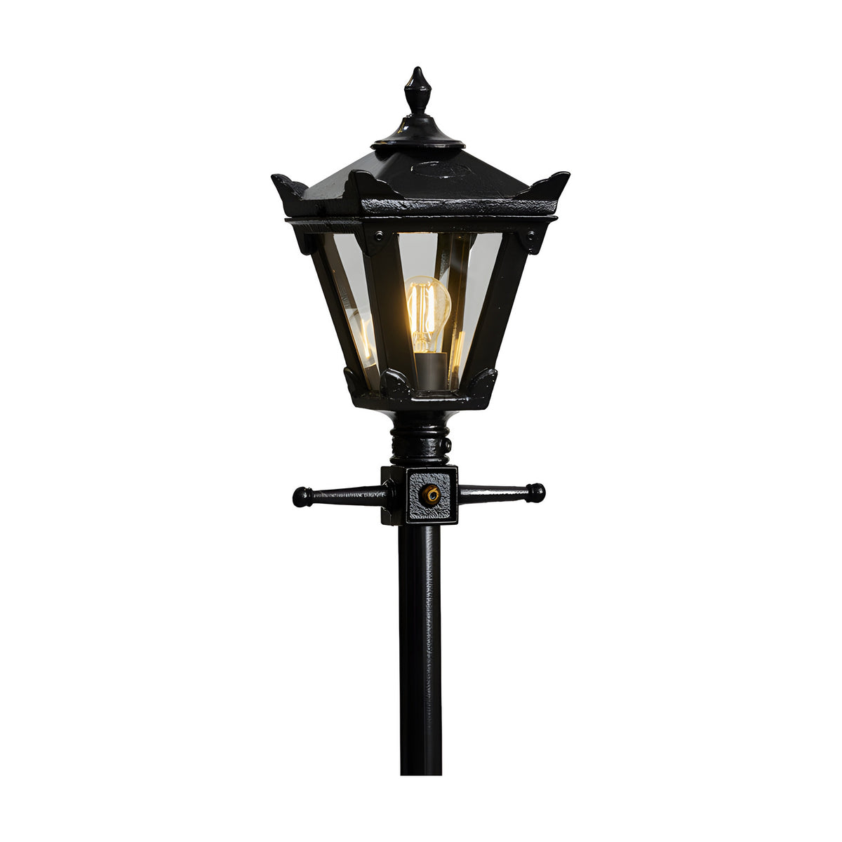 Victorian cast iron replacement lantern in black with a hexagonal glass-paned head, decorative finial, and mounting bracket atop a matching post, shown lit against a plain white background.