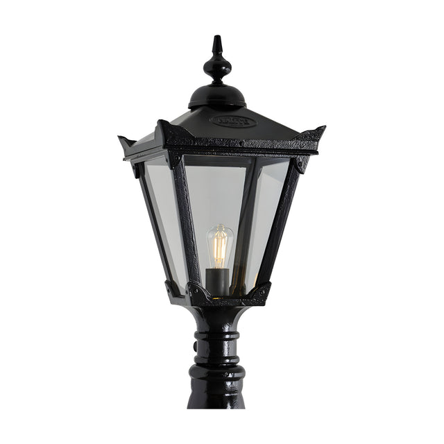 Victorian Manor replacement lantern head in black metal, hexagonal design with clear glass panels and an exposed filament bulb, shown against a plain white background.