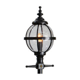 Cast iron globe lantern head in black with clear glass panels and ornate finial top, shown lit on a plain white background, designed to fit a 62mm spigot post.