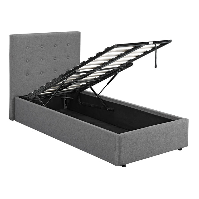 Lucca Single Plus Ottoman Bed Frame in grey linen-type fabric, showing the buttoned headboard and raised slatted base revealing the storage compartment, on a plain white background.