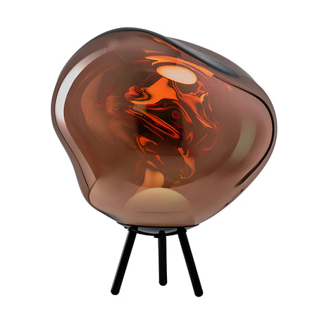 The Lava Large LED Floor Light - Copper features a modern, abstract design with a large, irregular amber glass shade, three-legged black base, and integrated LED module for warm illumination, shown against a white background.