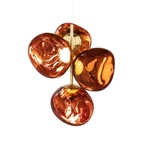 The Lava LED 4 Light Chandelier – Copper features four glossy, amber-toned, irregular glass shades clustered on a central copper fixture, suspended by a thin cord, and offers dimmable lighting for customizable ambiance.