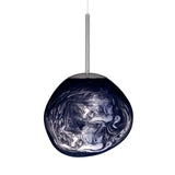 The Lava Small LED Pendant Light - Smoked Blue features a swirling marbled blue and white glass shade suspended from a slim metallic rod, creating sculptural illumination against a crisp white backdrop.