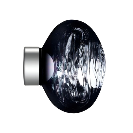 A round, dark, glossy Lava Small LED Wall & Ceiling Light in Smoked Blue with a swirling glass-like texture and a Smoked Silver metallic cap on the left, set against a white background.