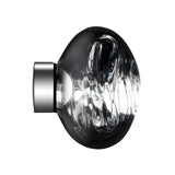 The Lava Small LED Wall & Ceiling Light - Silver features a round, clear glass shade with swirling patterns on a short, modern silver base, shown against a white background.