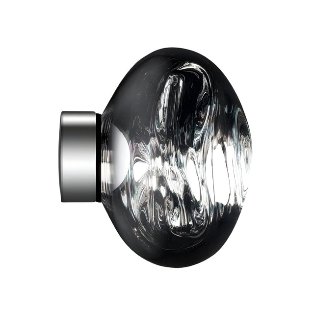 The Lava Small LED Wall & Ceiling Light - Silver features a round, clear glass shade with swirling patterns on a short, modern silver base, shown against a white background.