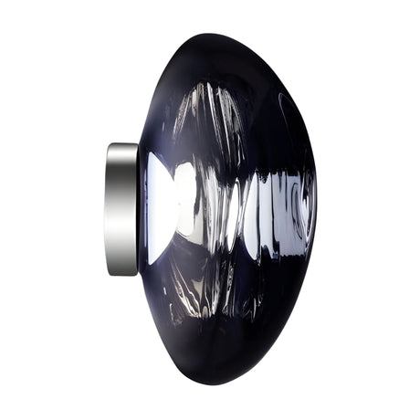 The Lava Large LED Wall & Ceiling Light - Smoked Blue features a modern dome-shaped smoked blue glass shade and metallic base, photographed on a white background. Its textured surface reflects light, creating ambient illumination.
