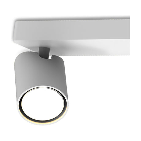 Close-up of the Sal 4 Light GU10 Linear Spotlight in matt white, showing one cylindrical head with a black ring detail mounted beneath the slim ceiling bar on a white background.