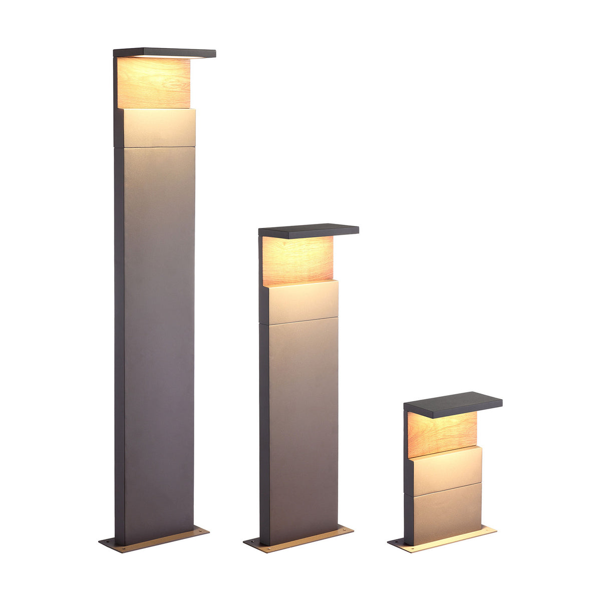 Three Ruka floor lamps of varying heights in anthracite with walnut accents, each with a slim upright body, angled top shade, and warm white LED glow, shown on a plain white background.