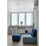 Torch Semi Flush Ceiling Light 73cm in sand white, with five slim LED bars arranged in a crossed pattern, mounted on a white ceiling above a living room seating area.