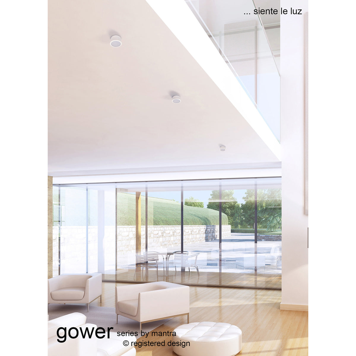 Gower Spotlight 7W 3000K 80mm in sand white, shown as recessed round ceiling downlights in an open-plan living space with glass walls and a garden view.