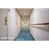 Lamborjini GU10 round spotlight, 93mm white polycarbonate ceiling fitting, shown recessed along a hallway ceiling with blue patterned carpet below.