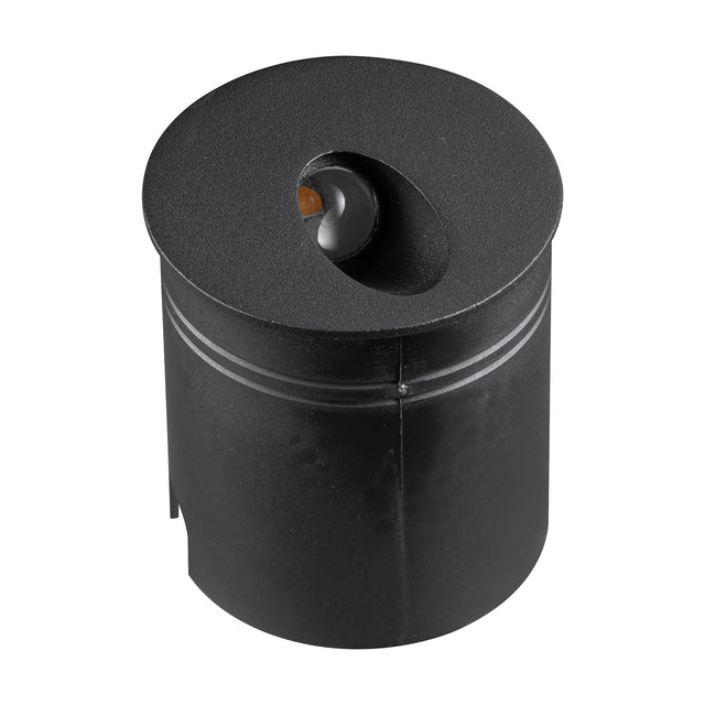 Aspen IP65 round recessed outdoor wall light in sand black aluminium, cylindrical body with angled amber-tinted LED lens on top, shown on a plain white background.
