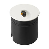 Aspen IP65 round recessed outdoor wall light in matt sand white, cylindrical black body with a round white face plate and angled LED aperture, shown on a plain white background.