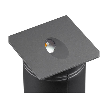Aspen IP65 outdoor wall light in anthracite, close-up of the square 80mm face with recessed angled LED lens, mounted on a cylindrical black post against a white background.