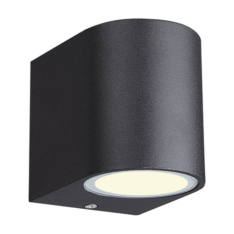 Kandanchu Round Outdoor Wall Light in sand black aluminium, cylindrical form with a single downward light source and visible mounting screw, shown on a plain white background.