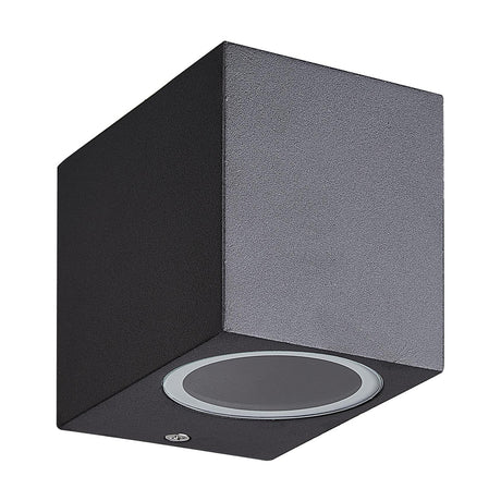 Kandanchu IP54 outdoor wall light in sand black, a compact cuboid aluminium fixture with a round GU10 lamp cover, shown on a plain white background.