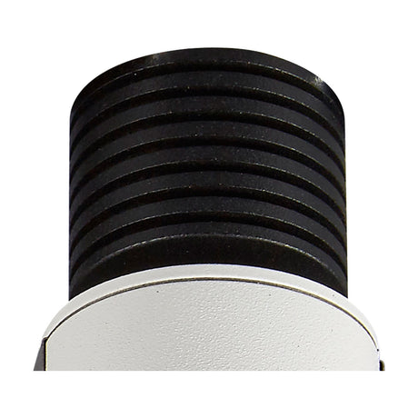 Close-up of the Guincho 5W Spotlight showing its ridged matte black heat sink body above a sand white round trim, 55mm dia, on a plain white background.