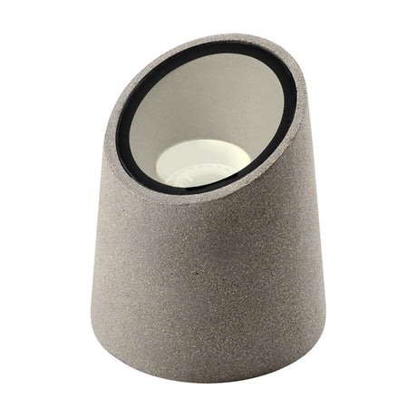Taos IP65 ground light in dark grey cement, angled cylindrical body with recessed GU10 light source, shown on a plain white background.