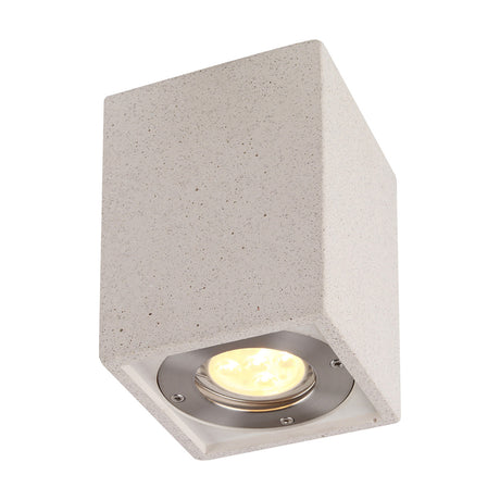 Levi GU10 rectangular spotlight in white concrete, a square block fixture with a recessed GU10 lamp lit warm white, shown on a plain background.