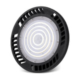 Urano UFO-style LED downlight in black aluminium, 26cm round body with vented edge and concentric ring lens, 150W 5000K daylight, IP65, on a plain white background.