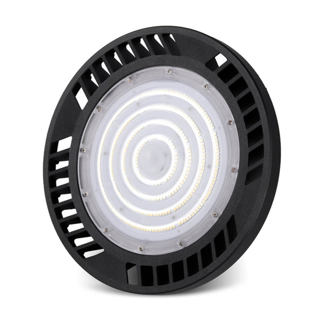 Urano UFO-style LED downlight in black aluminium, 26cm round body with vented edge and concentric ring lens, 150W 5000K daylight, IP65, on a plain white background.