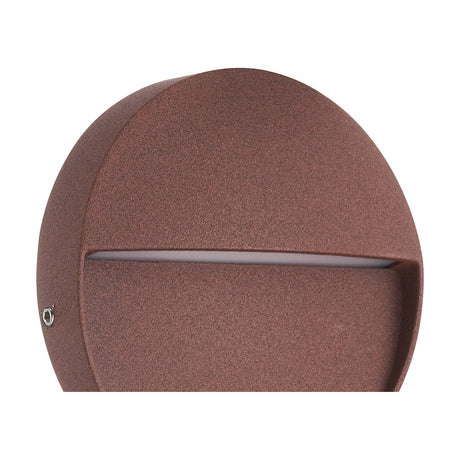 Close-up of the Baker 3W IP54 round outdoor wall light in rust brown, 11cm aluminium disc with a horizontal light slot and visible fixing screw, shown against a white background.