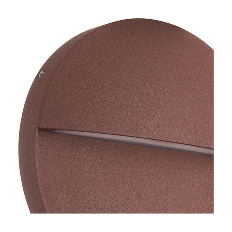 Close-up of the Baker 6W IP54 Round Outdoor Wall Light in rust brown, showing the aluminium disc with a narrow horizontal light strip and visible fixing screw.