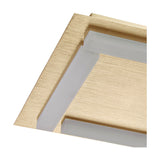 Close-up of a brushed gold Magneto track light fixture corner, showing the recessed frosted diffuser strip against a slim metal profile on a white background.
