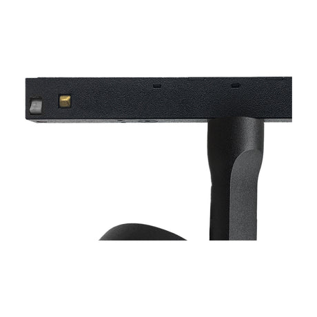 Close-up of the Magneto 10W Dimmable Track Light in black, showing the flat 75mm disc head with integral LED and connector pins, mounted on a black track arm against a white background.