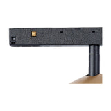 Close-up of the Magneto 7W Dimmable Track Light's black textured track base with gold connector and mounting cylinder, shown against a plain white background.