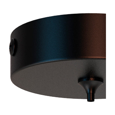Close-up of the Elsa Round Canopy Kit 10cm in black metal, a shallow round ceiling plate with side cable entry and a central flex outlet, shown against a plain white background.