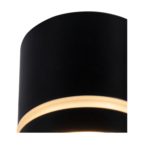 Close-up of the Split GX53 Spotlight 84mm in black, showing its round aluminium body and recessed lamp aperture with warm light glow, on a plain white background.