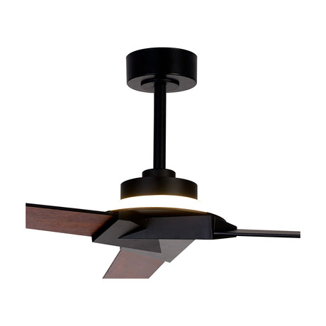 Brisa ceiling fan with integrated LED light, black housing and motor with wood-finish blades, close-up on the central light fitting and blade joins against a white background.