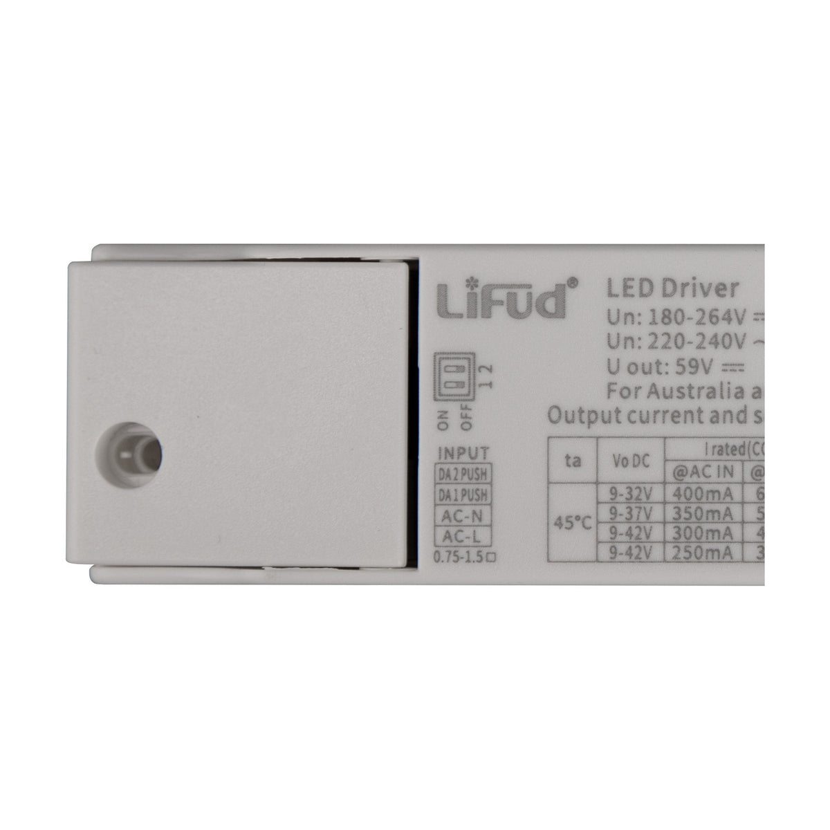 Sunset Driver 15W 14cm LED driver in white, close-up of the flat casing showing DIP switches, input terminal labels, and printed output specifications.