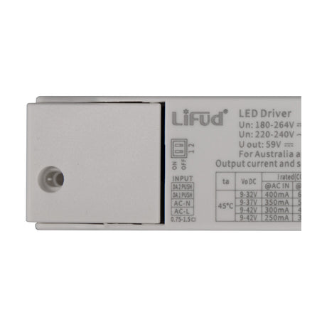 Sunset Driver 15W 14cm LED driver in white, close-up of the flat casing showing DIP switches, input terminal labels, and printed output specifications.
