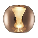 Andromeda Round Lamp Shade 13cm in copper glass with a frosted inner funnel, gently domed globe shape shown lit against a plain white background.