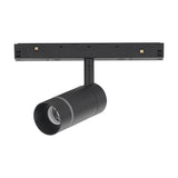 Magneto Track Light in black aluminium, showing a cylindrical spotlight head with adjustable knuckle mounted on a magnetic track bar, 7W 3000K LED, on a plain white background.
