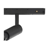 Close-up of the Magneto Track Light in black aluminium, showing the single cylindrical spotlight head with adjustable neck mounted on the track connector, set against a plain white background.