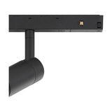 Close-up of the Magneto Track Light spotlight head in matte black, adjustable cylindrical fitting attached to a black magnetic track with integrated connectors, shown on a plain white background.