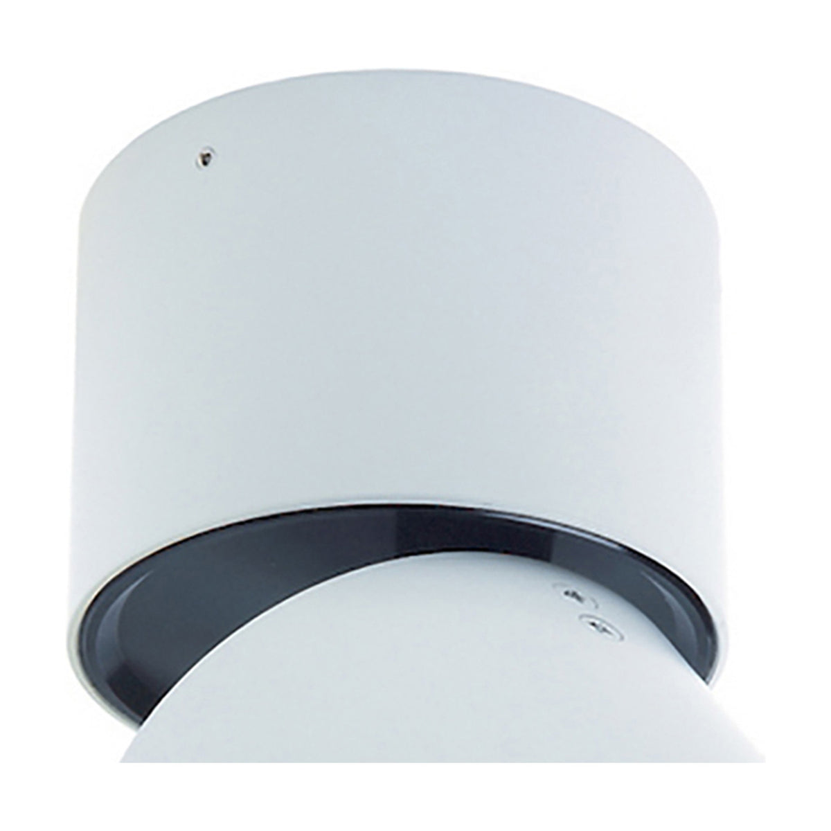 Close-up of the Columbretes Round Spotlight, a cylindrical 85mm matt white spotlight with an adjustable black-trimmed rotating head, shown against a plain white background.