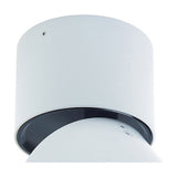 Close-up of the Columbretes Round Spotlight, a cylindrical 85mm matt white spotlight with an adjustable black-trimmed rotating head, shown against a plain white background.