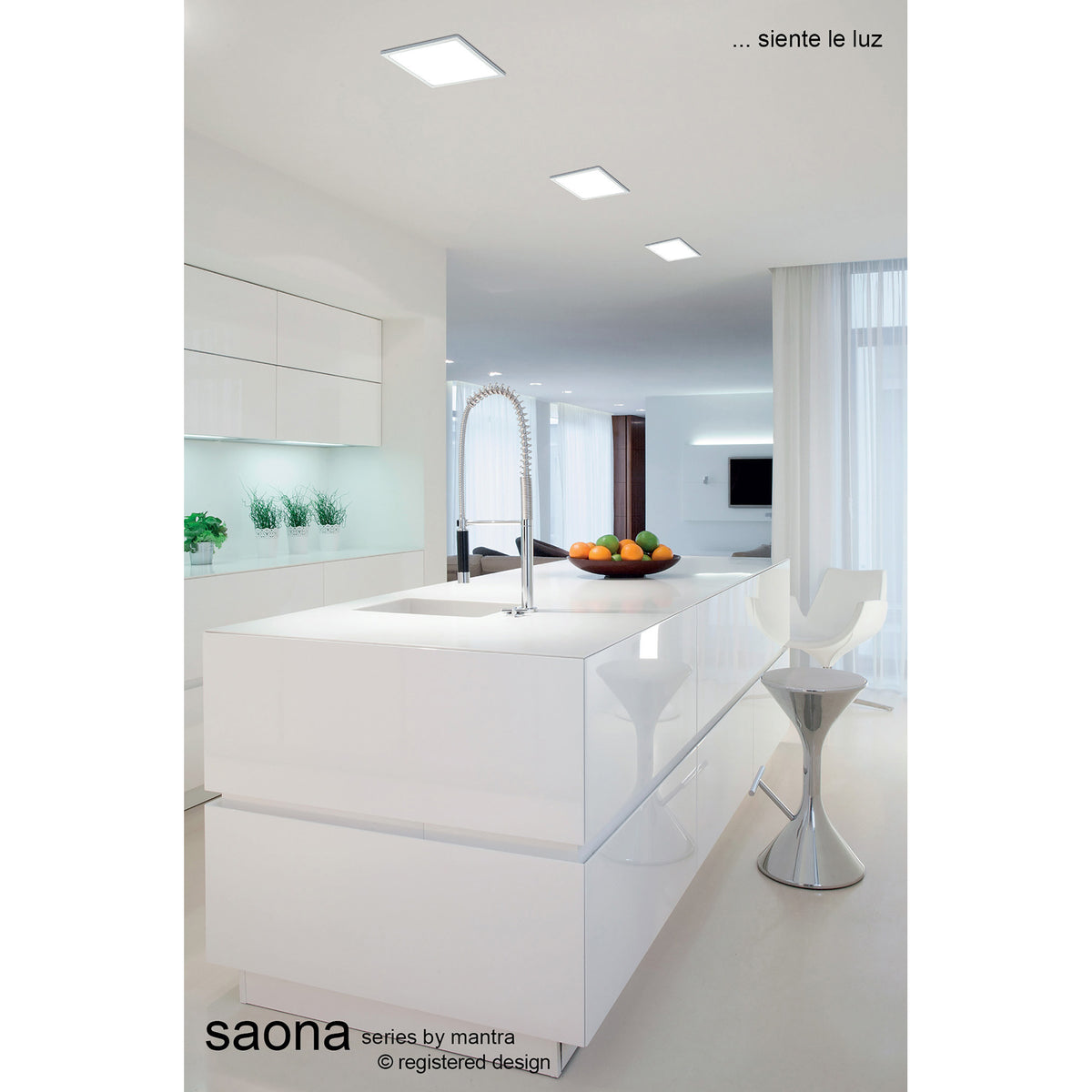 Saona square recessed downlight with matt white trim and diffused panel face, shown installed flush in a white kitchen ceiling above an island unit.