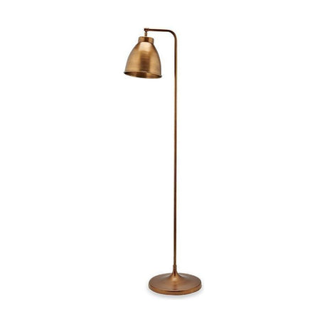 Vernenne Floor Lamp in antique brass, with a bell-shaped metal shade on a cranked arm, slim column, and wide round base, shown on a plain white background.
