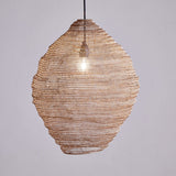 Mukuni Large Wire Lampshade in brass-toned knitted mesh, tall lantern shape with full belly, hung pendant-style with visible bulb against a plain grey background.