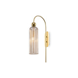 Antic wall light in gold with cognac glass, offering a warm and vintage-inspired aesthetic.